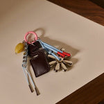 Přívěsek na tašku / klíče THE STICKY SIS CLUB Chocolate | Lavly.cz